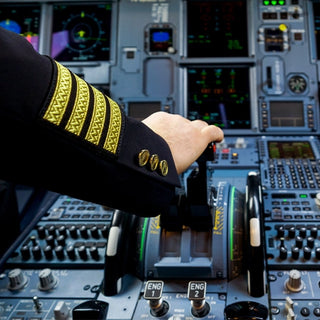 Pilot with joystick showcasing Urb Shop's aviation theme